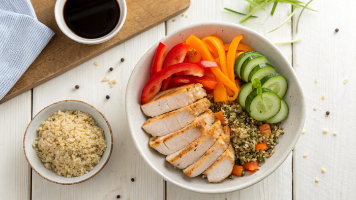 Cooking chicken breast for healthy high-protein bowl